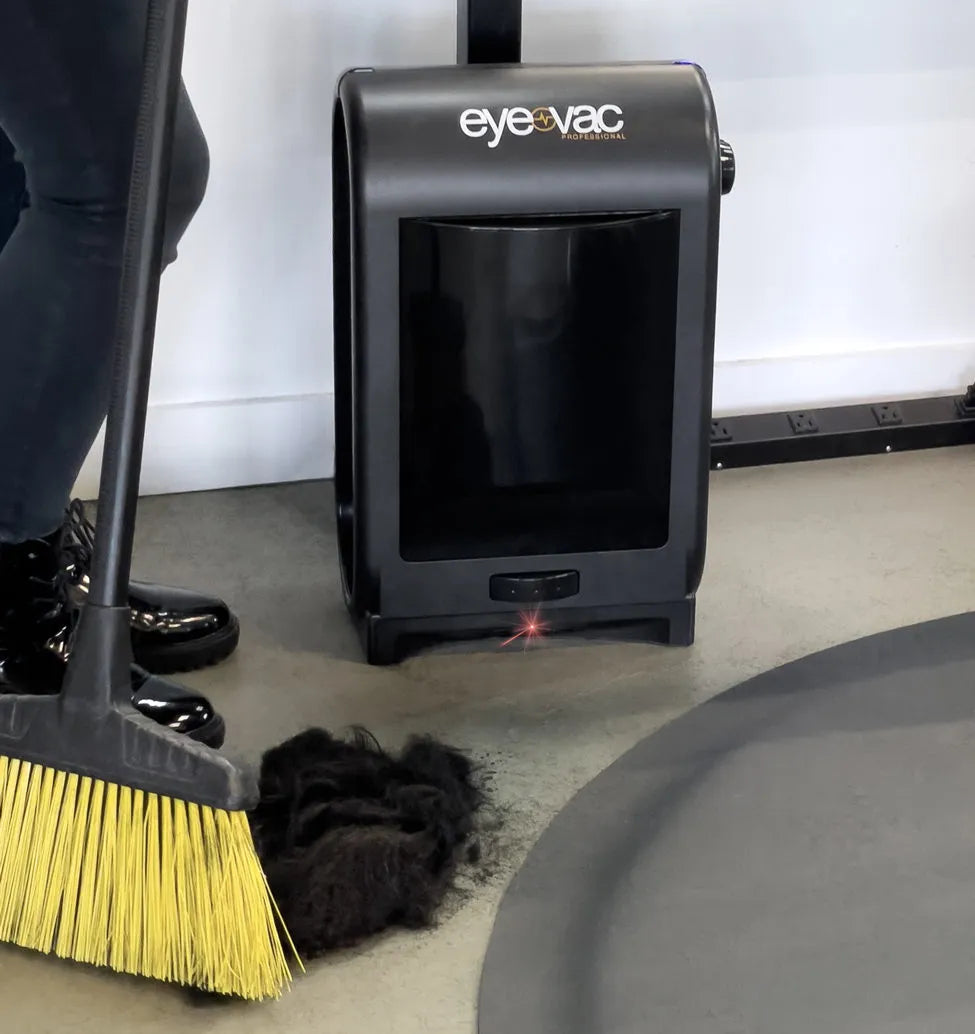 Woman sweeping in front of EyeVac